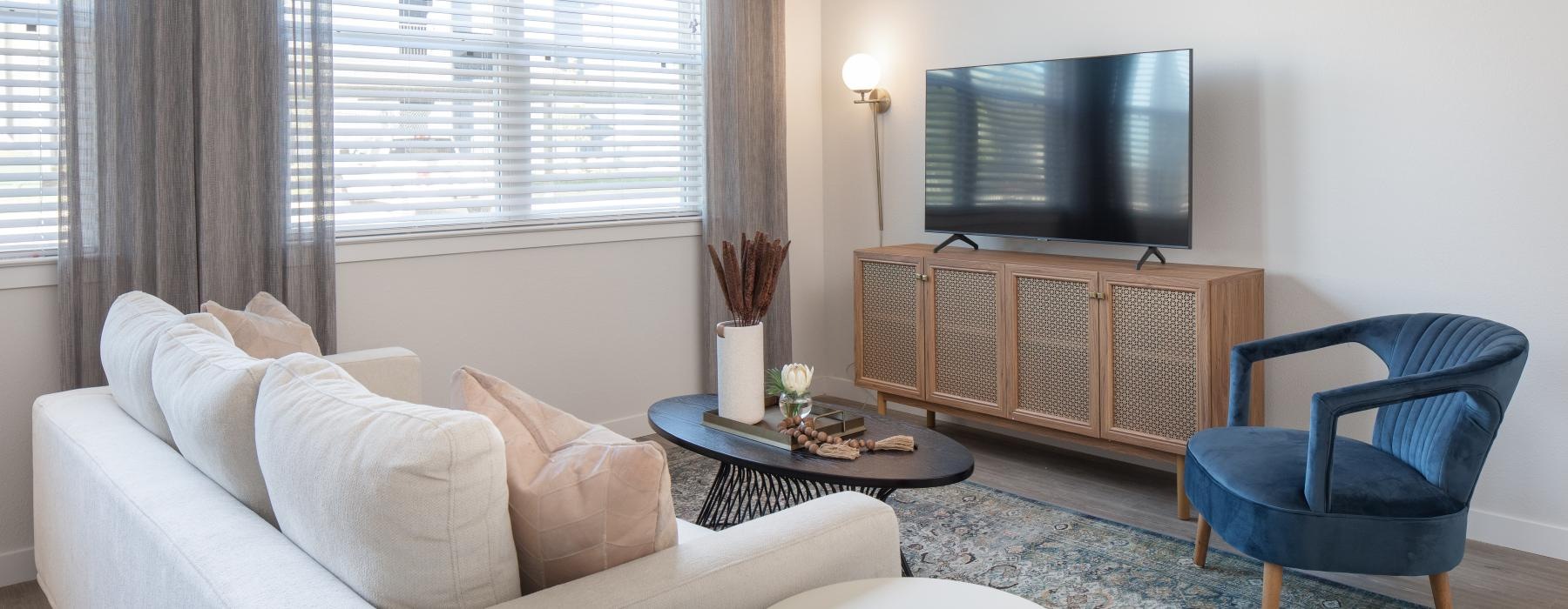 a living room with a tv and couches